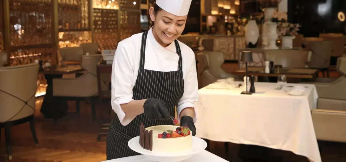 A chef preparing a delicious fruit cake during a cooking class in Dubai