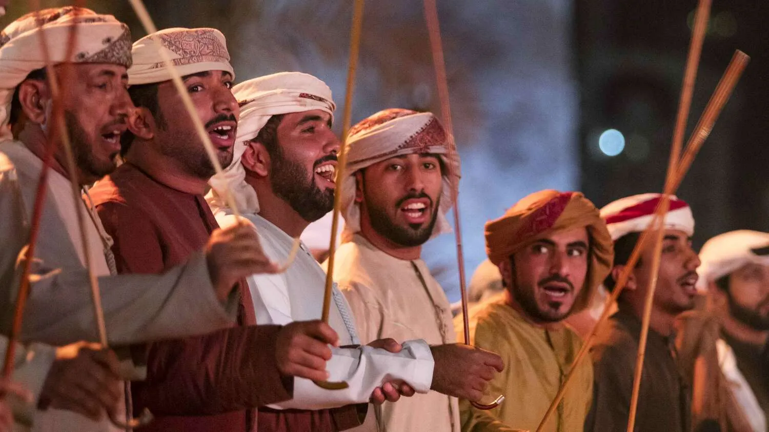 Men performing the Al Alaya dance in UAE.