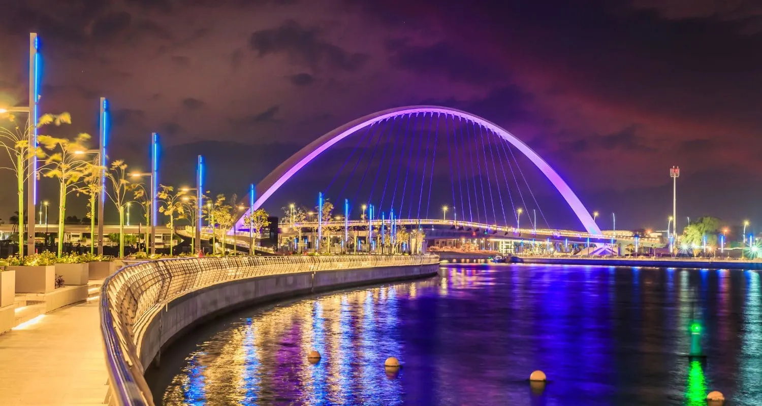 Illuminated Dubai Canal during nighttime