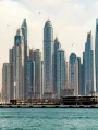 Dubai skyline above the waterfront during peak summer heat