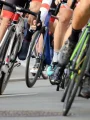 Road cyclists riding in a tight pack, the kind of mass ride Dubai Fitness Challenge 2026 will bring to the city